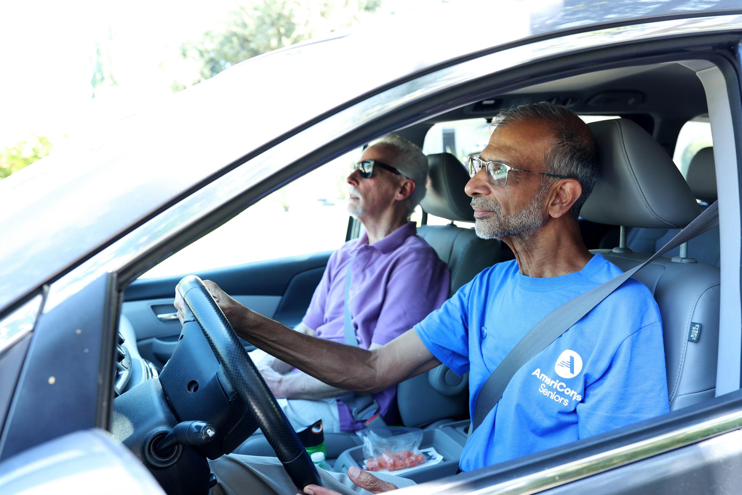 Volunteer driving a senior to an appointment.